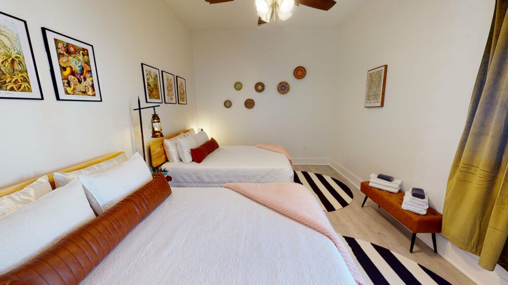 Bedroom 2- 2 queen beds, overhead fan, carefully designed
